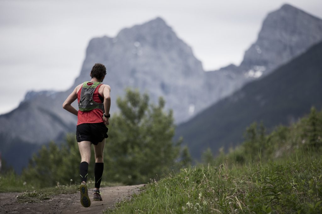 Trail runner running in mountains